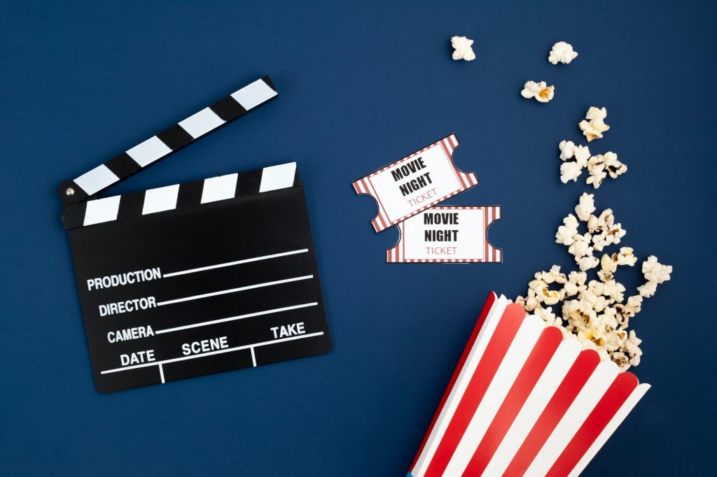 Movie clapperboard and cinema tickets. Home movie night, party invitation
